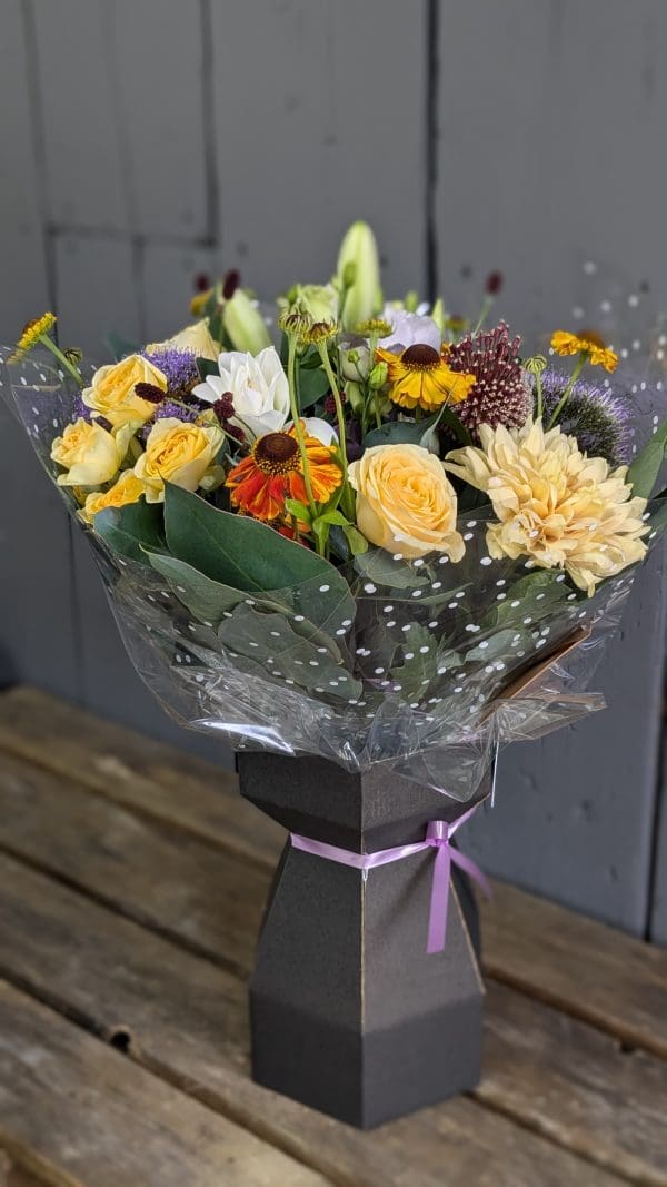 garden-of-eden-florist-stocksbridge-colourful-bouquet A bouquet of yellow autumnal coloured flowers